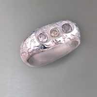 Funky sterling silver ring with 3 round brilliant flavors of chocolate diamonds weigh .72 ct. total weight