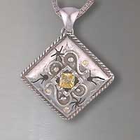 one of kind sterling silver pendant with a yellow diamond